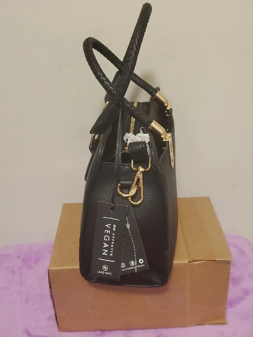 Structured Black Satchel with Braided Handles and Gold Accents